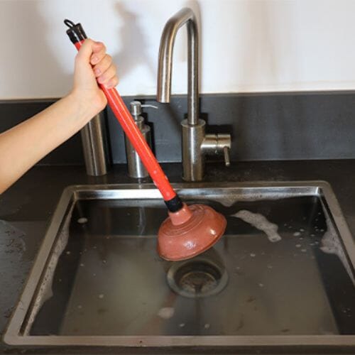 Professional clogged drain overflow cleanup service underway at a property in Pembroke Pines, FL