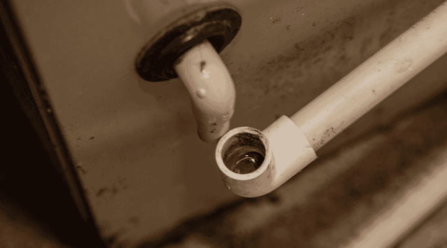 Professional AC drain line overflow cleanup service underway at a property in Alanreed