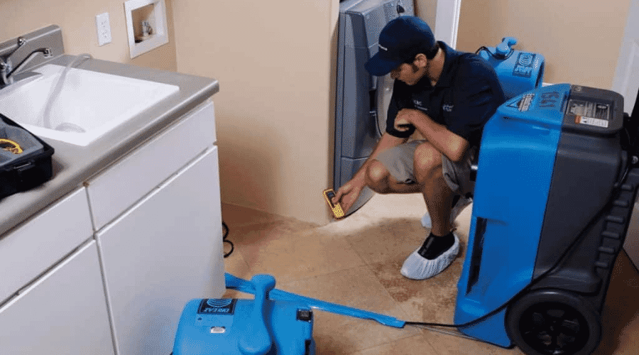 Professional refrigerator water leak cleanup service underway at a property in Bertram, TX