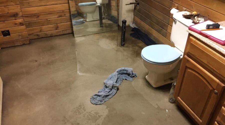 Professional toilet overflow cleanup service underway at a property in Big Spring, TX